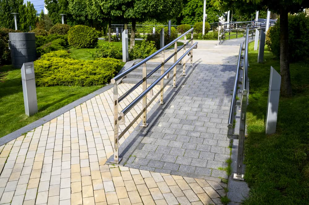 footpaths with steps made of colored stone tiles in landscape design, street tiles with patterns and ornaments
